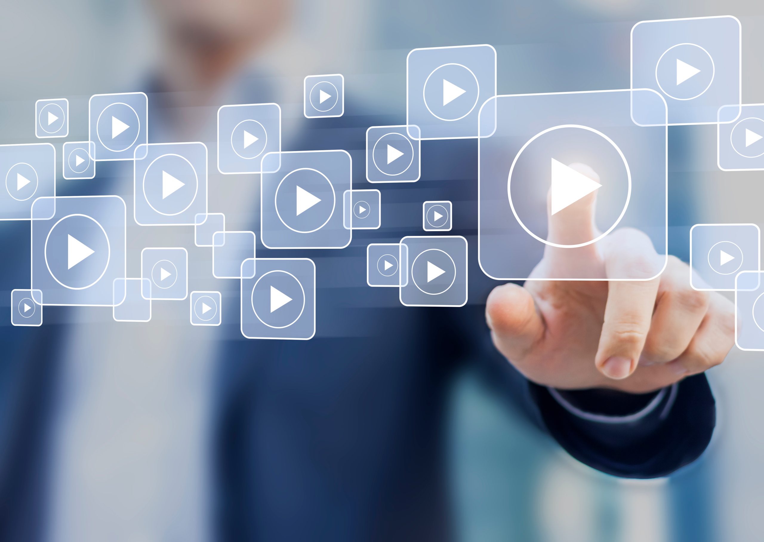 Video on demand technology with person touching play button on v