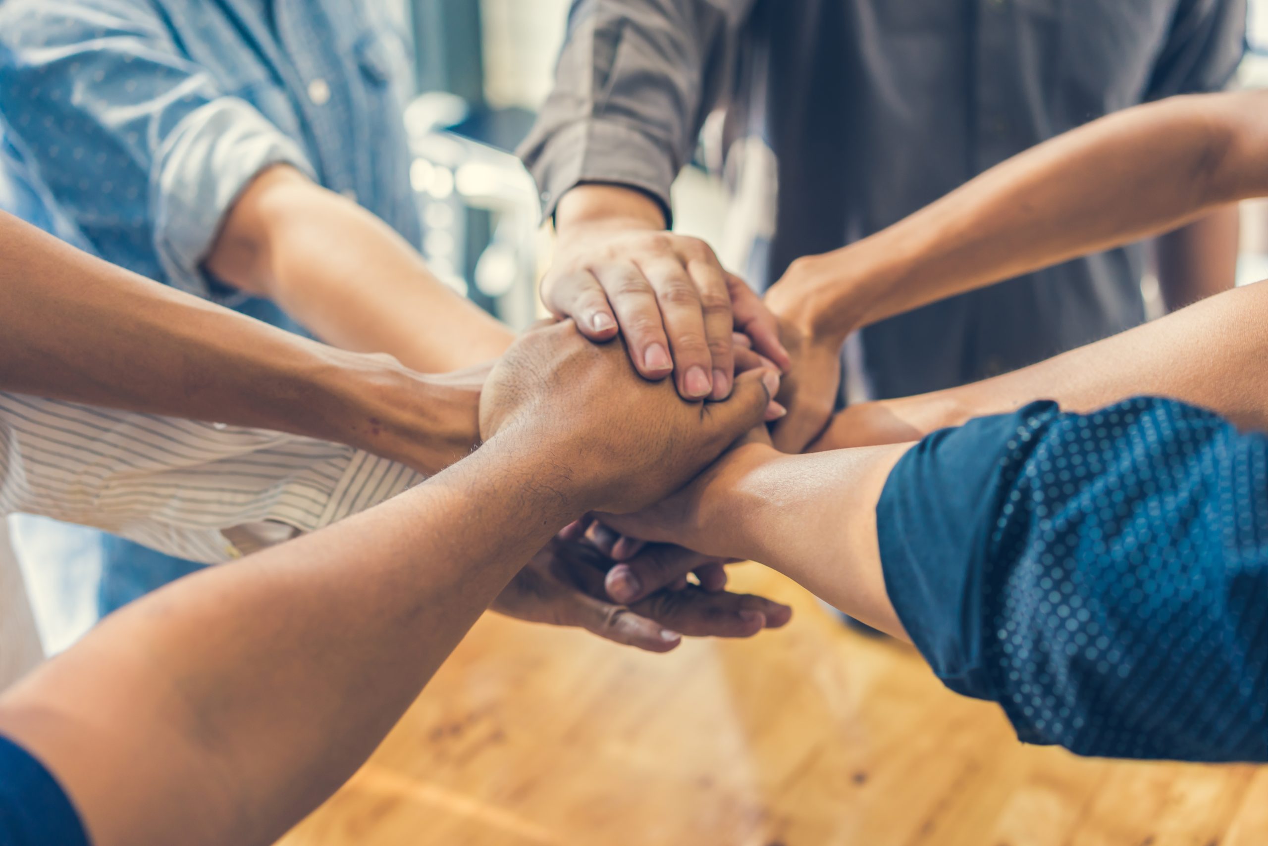 Business handshake and business people all in hands